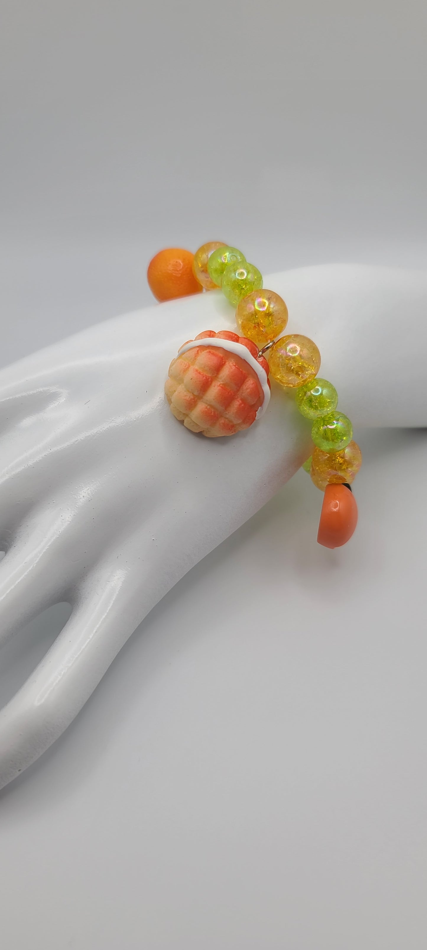 Orange and Green Beaded Elastic Bracelet with Orange and Pastry Bread Charms