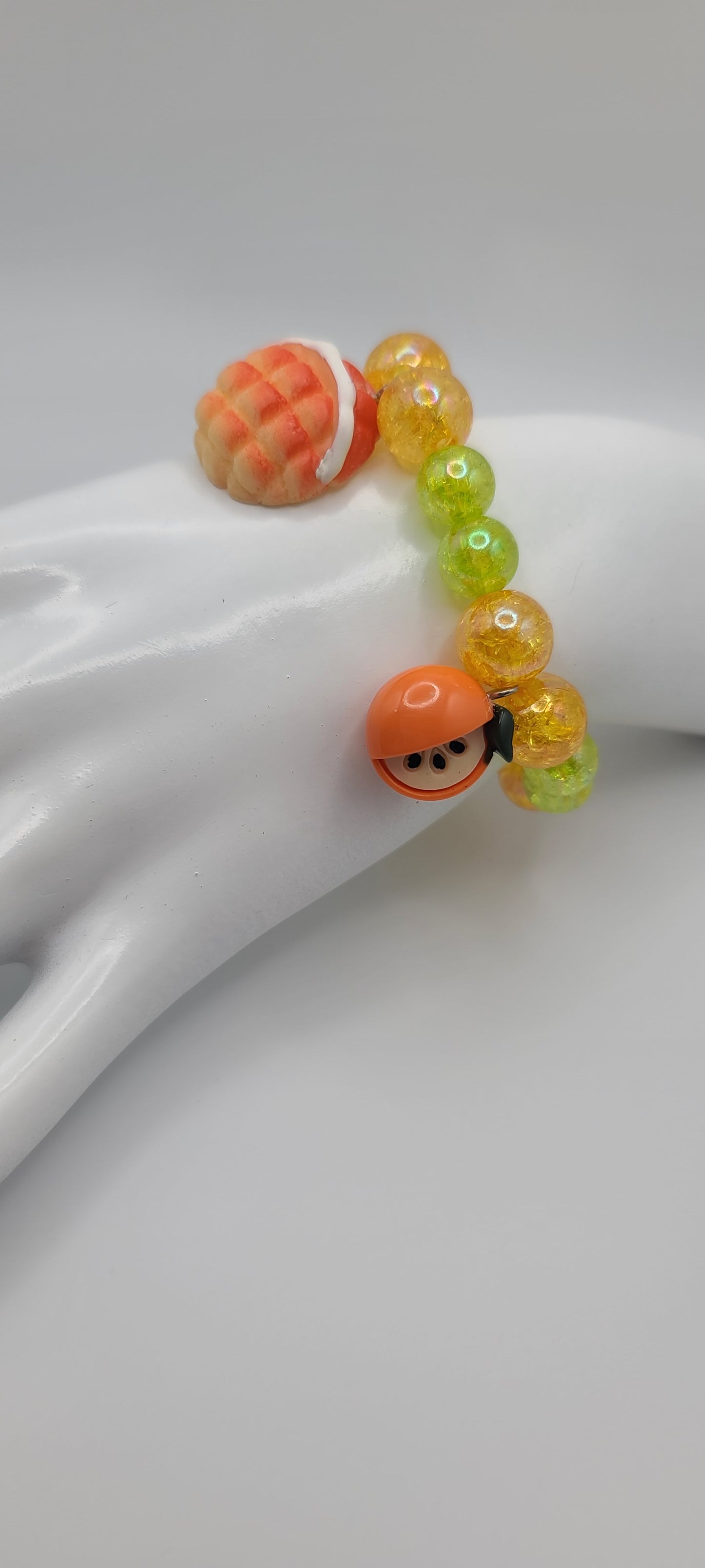 Orange and Green Beaded Elastic Bracelet with Orange and Pastry Bread Charms